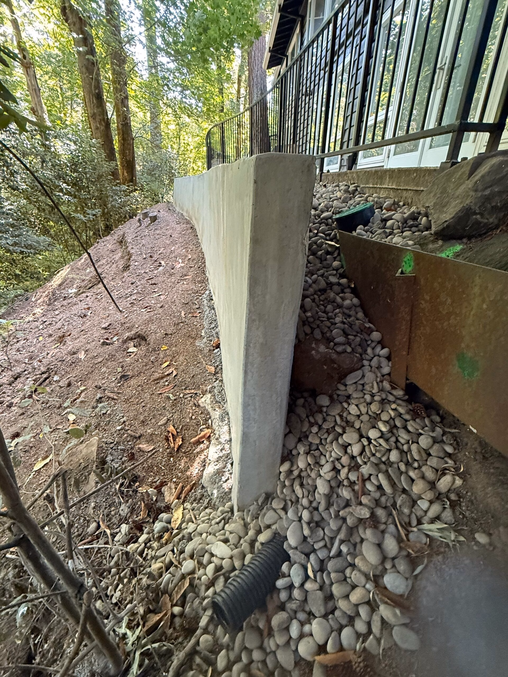 retaining wall construction and repairs to damaged existing walls
